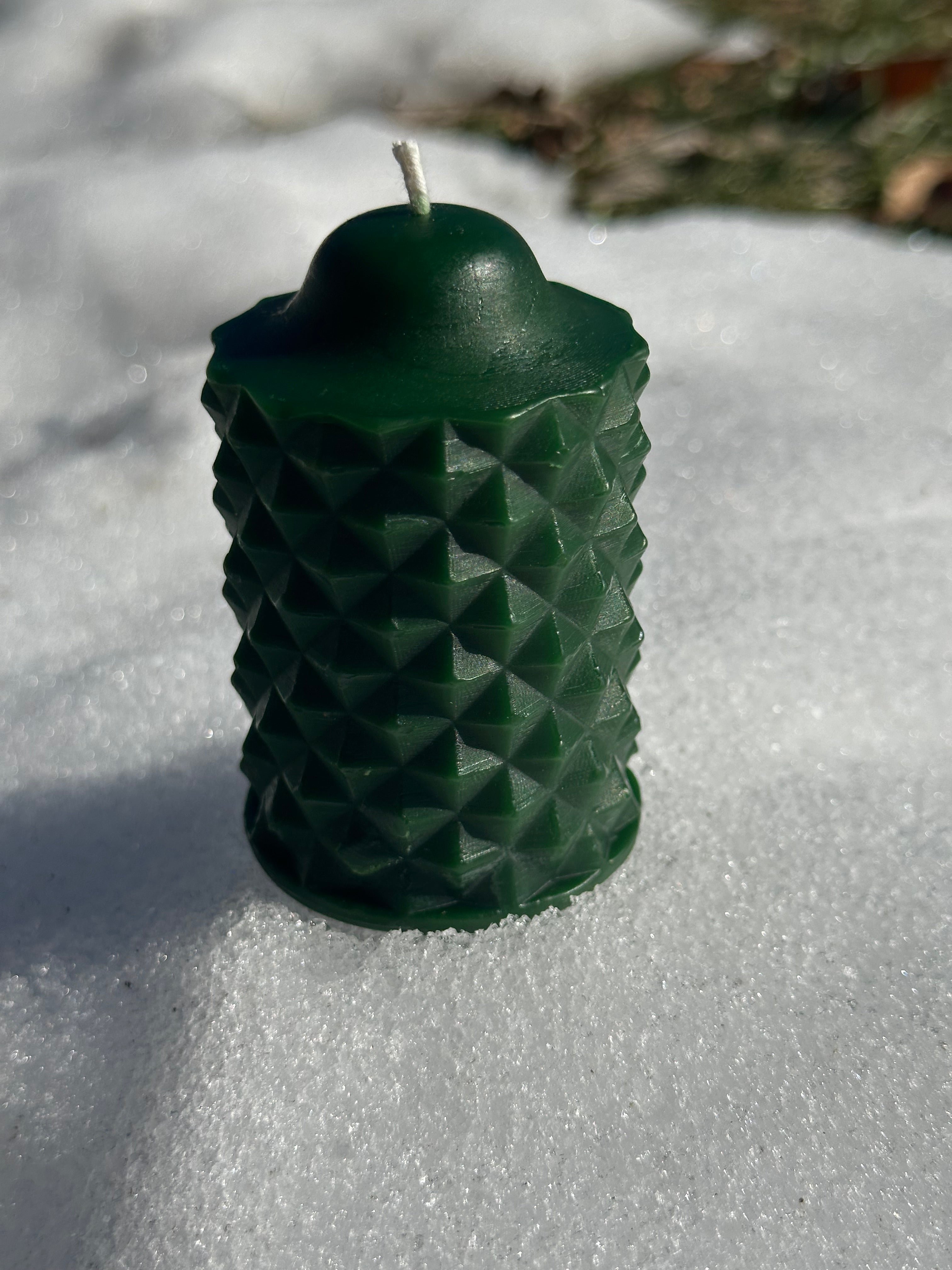 The green scallop beeswax candle from Hardwood Honey
