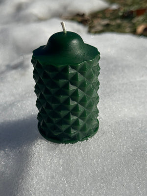 The green scallop beeswax candle from Hardwood Honey
