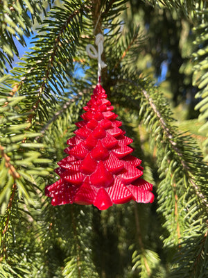 The color red is pronounced on a Christmas tree. Hardwood Honey provides ornament candles for the holiday season. The wick is extended and knotted to a hook. Just cut the wick about a quarter inch above the candle to light. Do not light candles close to or underneath a Christmas tree or anything flammable.