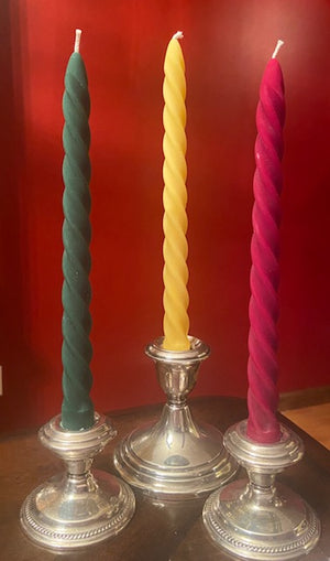 Twist taper candles in Christmas colors.
