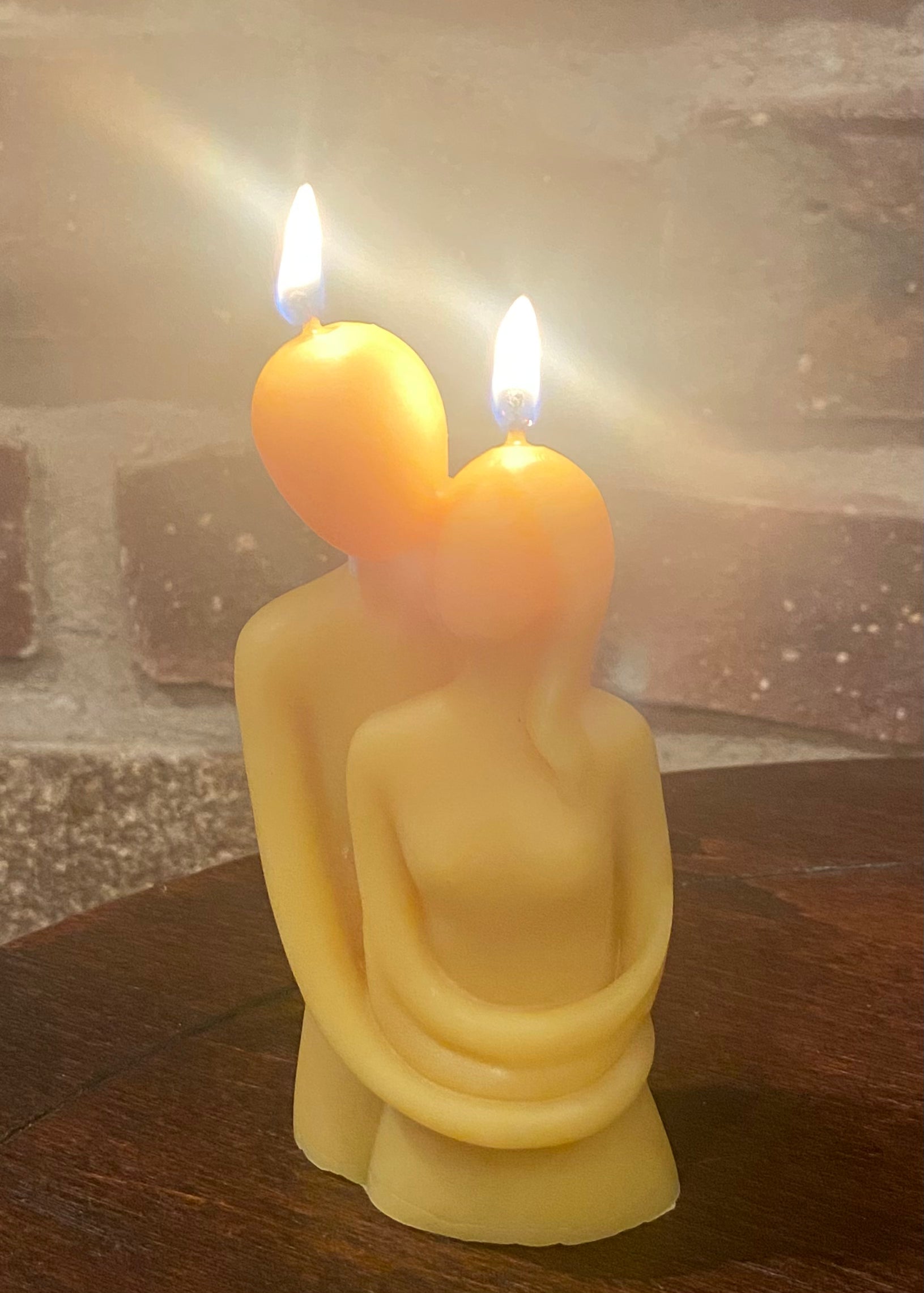 The embrace candle is lit. A thoughtful candle for date night at home.