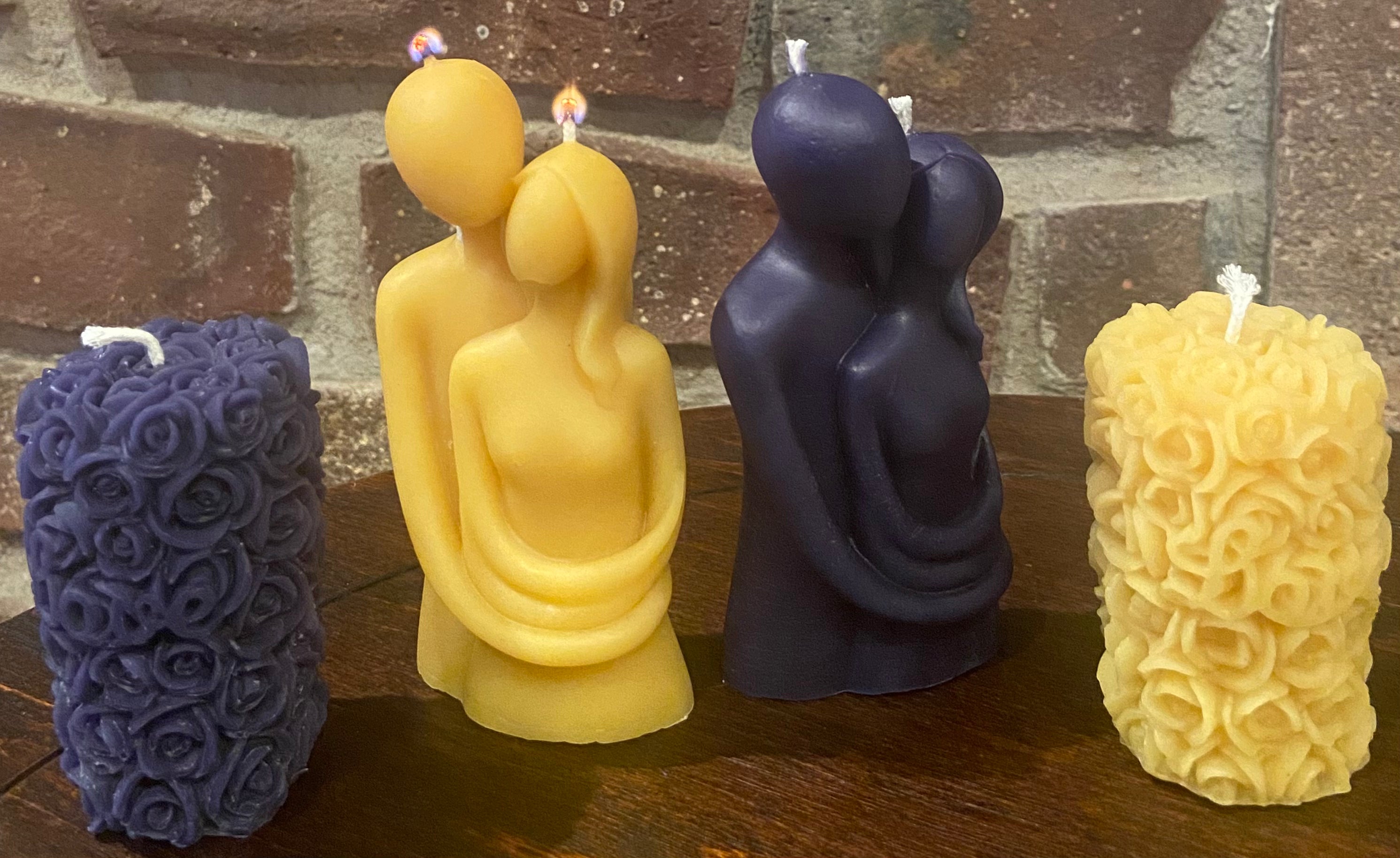 The embrace beeswax candle is just lit for the first time.