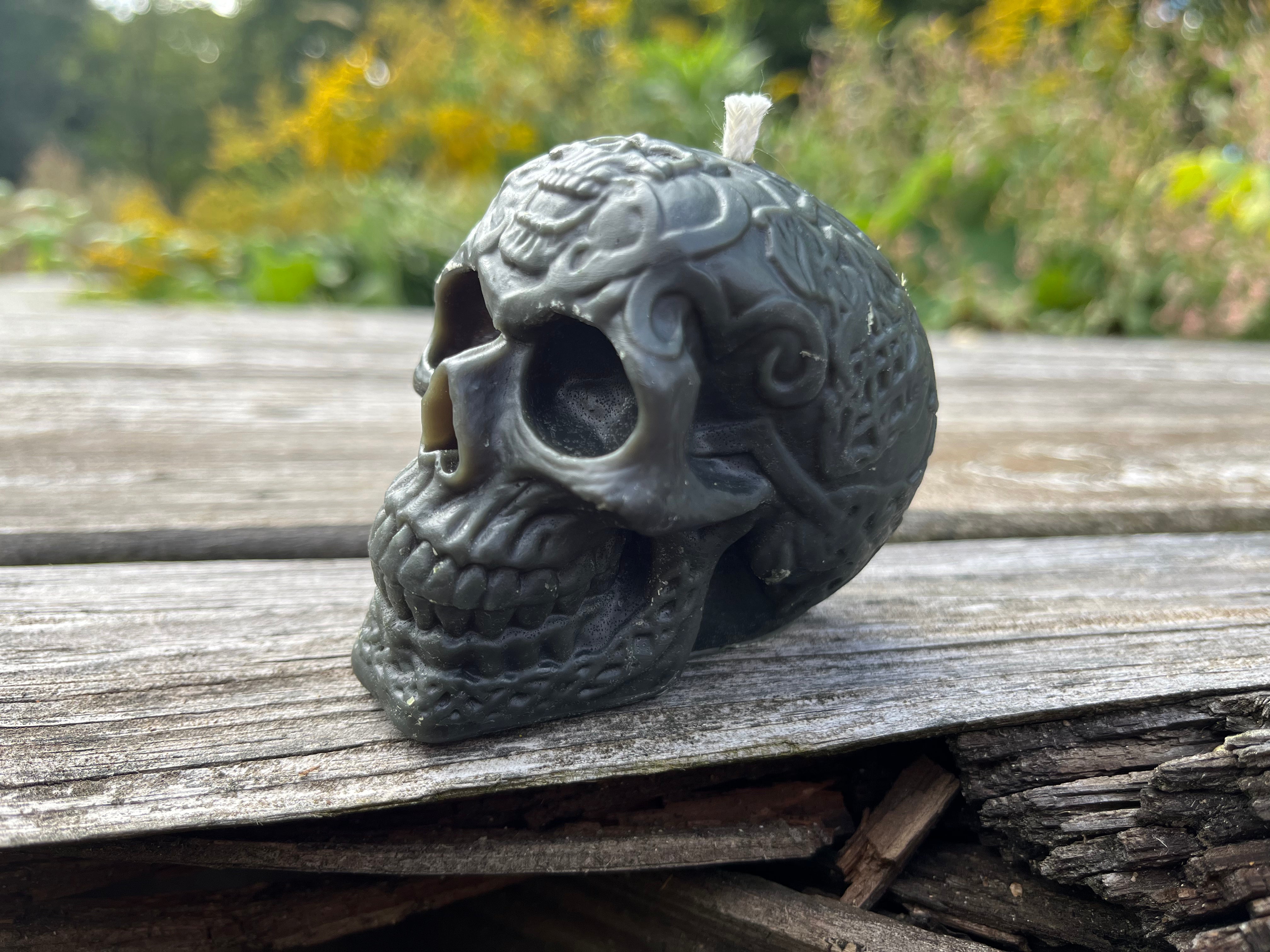 The human skull is decorated for Halloween. Poured with Indiana beeswax, and comes in a variety of colors.