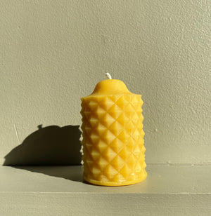 The scallop beeswax candle is a unique design. For Christmas, comes as an ornament candle.