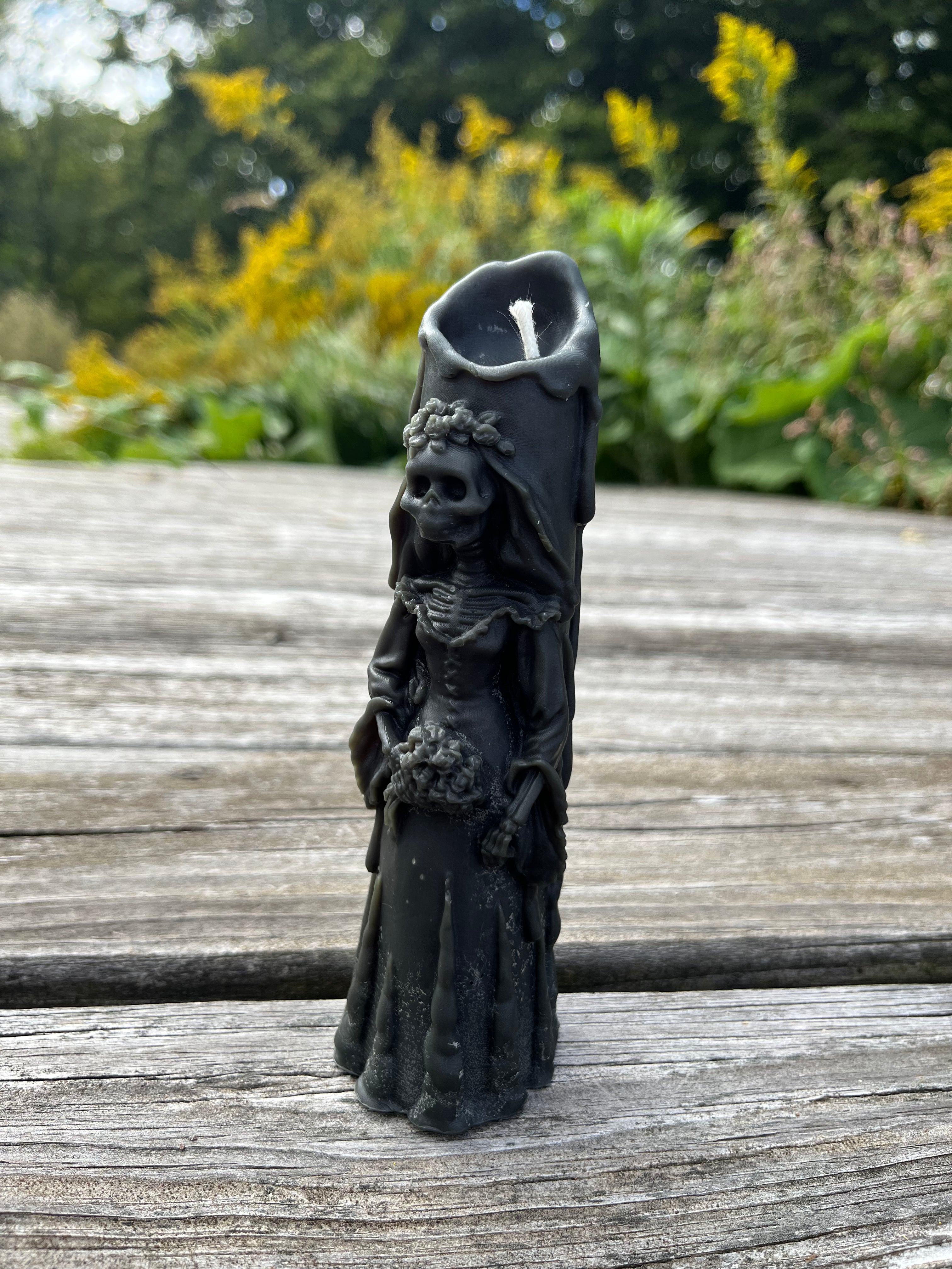 The skeleton bride is ready to get married for eternity on Halloween. Offered in a variety of colors by Hardwood Homey.