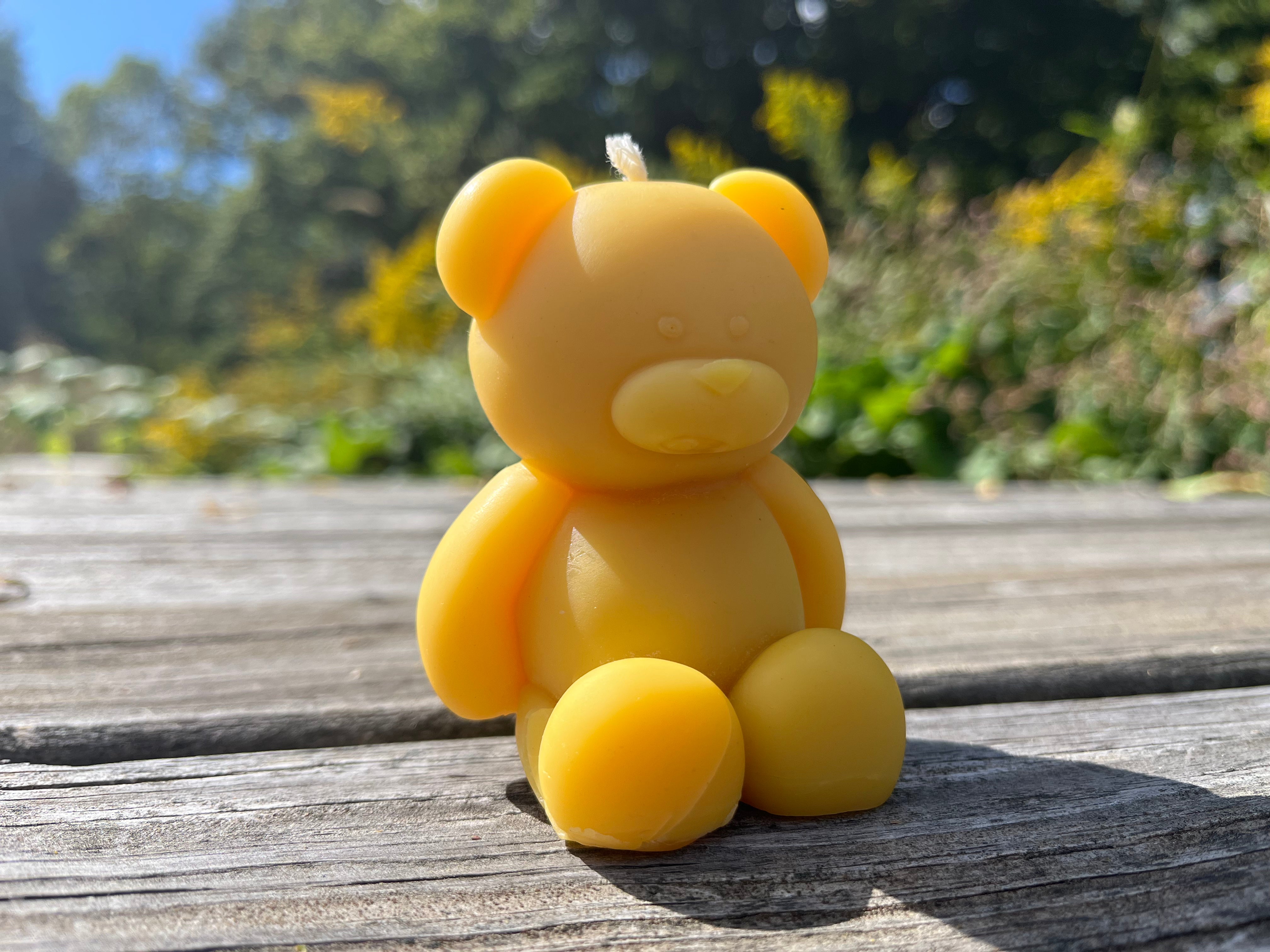 Made from Indiana beeswax, the teddy bear is almost too cuddly to light.