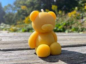 Made from Indiana beeswax, the teddy bear is almost too cuddly to light.