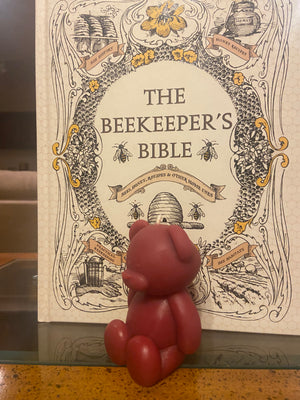 A side profile of the adorable teddy bear. The teddy bear's warmth will make you want to cuddle.