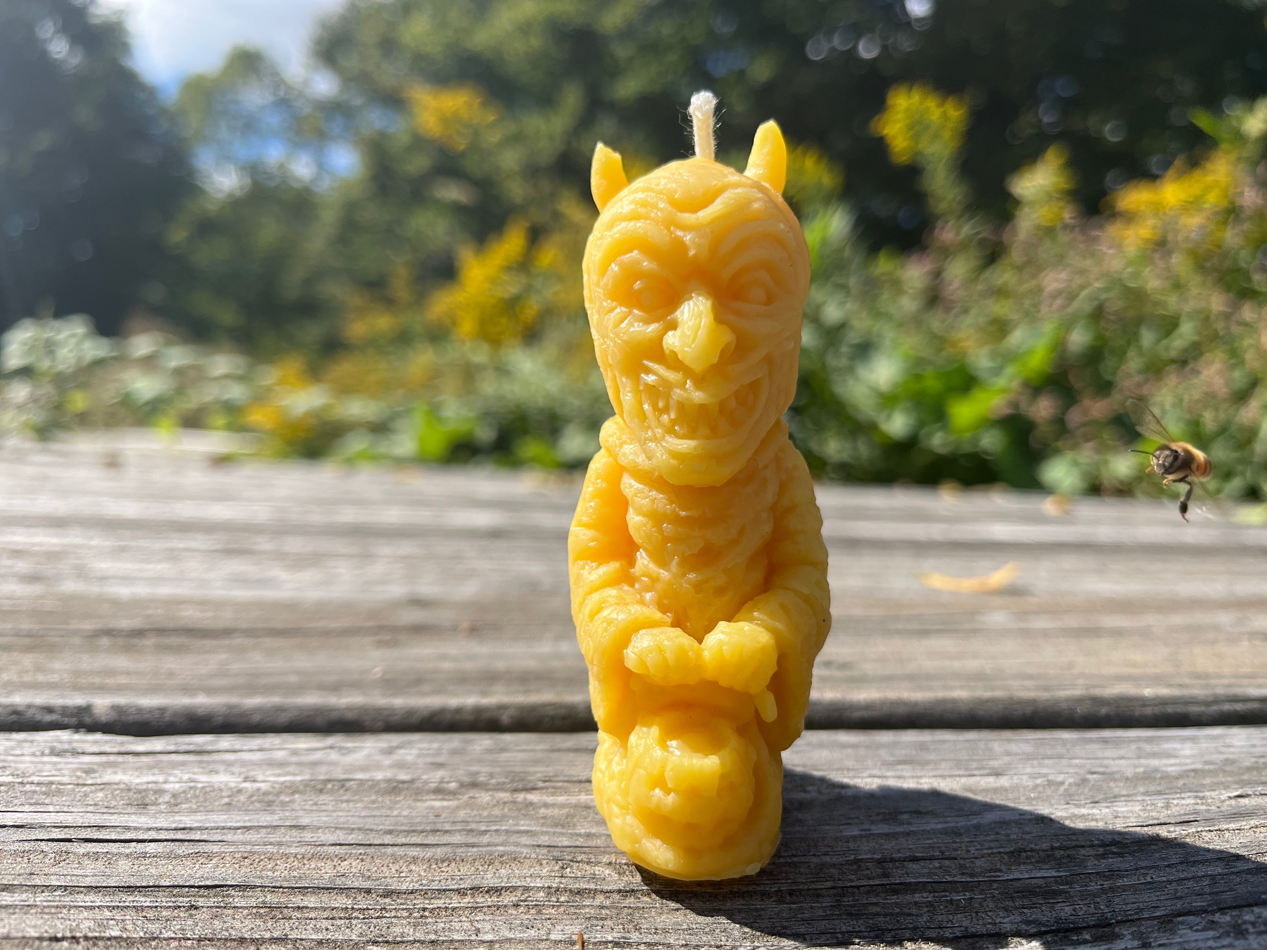 Made from Indiana beeswax. A honey bee zooms into view.